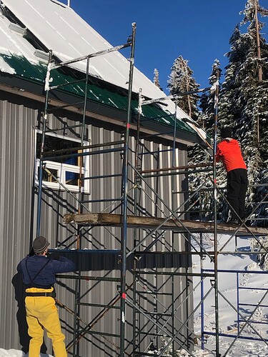 Keith and Ray first have to clear snow from the panels